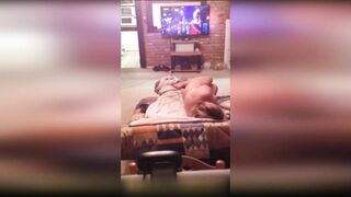 Attractive and horny housewife caught masturbating in front of TV