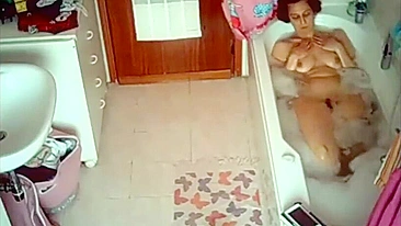 Curvy wife caught masturbating and reading while taking a bubble bath