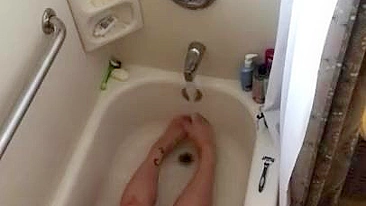 Chubby wife caught masturbating in the bathroom where she uses water