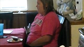 Fat mom caught sneakily masturbating while sitting near kitchen table