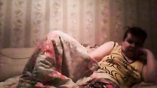 Mature mom caught sneakily masturbating under blanket on the sofa