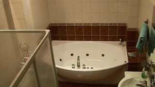 Wife caught masturbating while relaxing solo in the bath after work