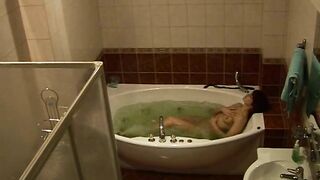 Wife caught masturbating while relaxing solo in the bath after work