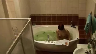 Wife caught masturbating while relaxing solo in the bath after work