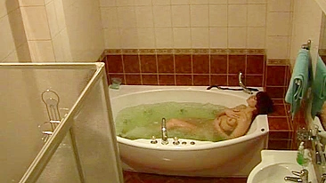 Wife caught masturbating while relaxing solo in the bath after work