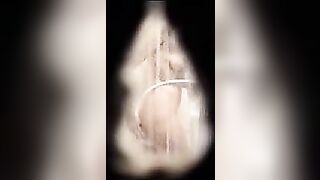 Pretty sister caught masturbating in the shower through a small hole