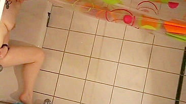 Sweet sister caught masturbating in the shower with help of water