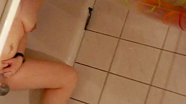 Sweet sister caught masturbating in the shower with help of water