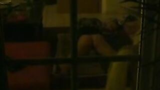 Sexy wife caught masturbating in the living room by peeping neighbor