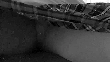 Mom is caught masturbating in black and white hidden camera video
