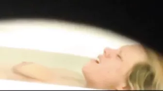 Mom is caught masturbating by son who films through the small hole