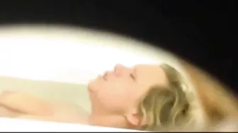 Mom is caught masturbating by son who films through the small hole