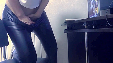 Whorey wife in tight pants is caught masturbating to porn close-up