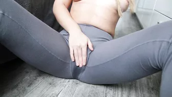 Girl's grey pants are as wet as muff during masturbation close-up