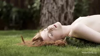 Pale-skinned naked girl plays with wet XXX hole lying on the pillow