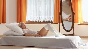 Blonde naked girl in white stockings satisfies pussy using XXX toy