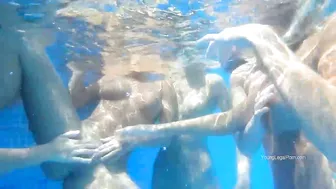 A crowd of teen naked girls enjoy hot lesbian XXX orgy by the pool