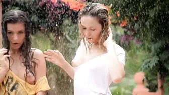 Two luscious naked girls pose for erotic XXX session in the rain