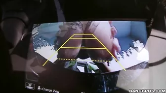 Inked mom demonstrates huge XXX tits while sitting in the backseat