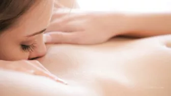 Two stunning girls indulge in lesbian passion on white bed