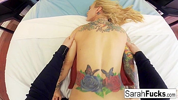 Tattooed bombshell Sarah Jessie sucks cock and gets nailed in doggystyle position by guy with camera
