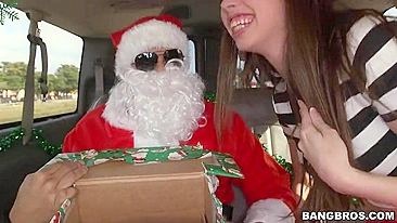 Cute gal strokes and sucks XXX dick of Santa Claus through gift box