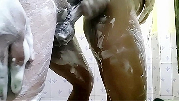 Naked Bhabhi covered with lather and fucked by Desi stud in bath
