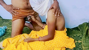 Innocent Desi woman in yellow sari tempted into chudai on the bed