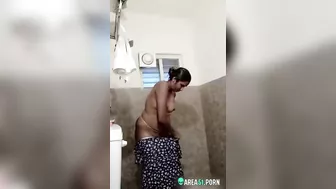 A plump indian aunty getting dressed after bath A plump indian aunty getting dressed after bath