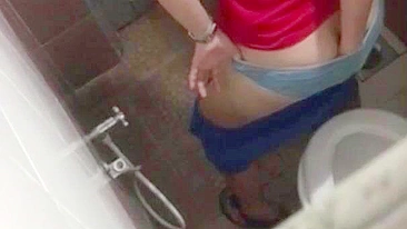 Pervert films caught video of Indian coed pissing in the restroom