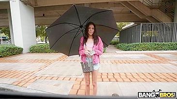 Brunette mom with umbrella is getting picked up on the XXX street
