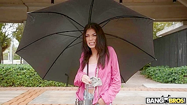 Brunette mom with umbrella is getting picked up on the XXX street
