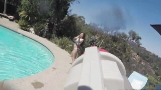 Chick fools around in pool with water gun and naked XXX body parts