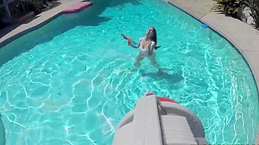 Chick fools around in pool with water gun and naked XXX body parts