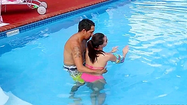 Minx in pink XXX bikini learns to swim together with Latin trainer