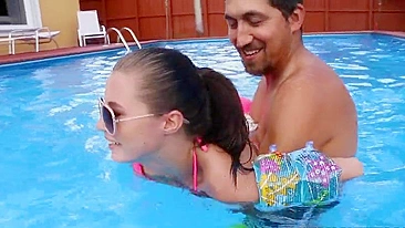 Minx in pink XXX bikini learns to swim together with Latin trainer