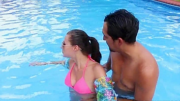 Minx in pink XXX bikini learns to swim together with Latin trainer