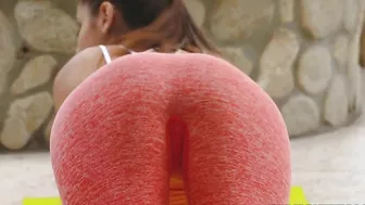 Fitness blogger stretches in hot XXX poses in front of her cameraman