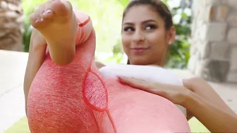 Fitness blogger stretches in hot XXX poses in front of her cameraman