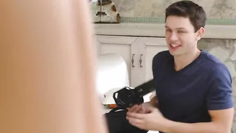 Fitness blogger stretches in hot XXX poses in front of her cameraman