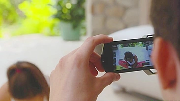 Fitness blogger stretches in hot XXX poses in front of her cameraman