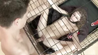 Skinny girl with curly hair is fucked by the XXX guy through a cage