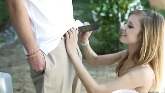 Obedient chick in the light dress sucks a XXX sized cock in nature