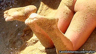 Adult model Carol Goldnerova washes massive boobs then covers body with sand
