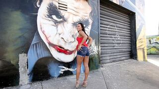 Mom walks by graffiti wall and brandishes her XXX assets on camera