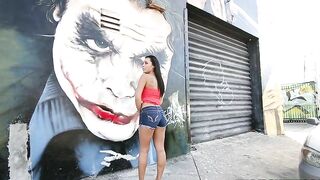 Mom walks by graffiti wall and brandishes her XXX assets on camera