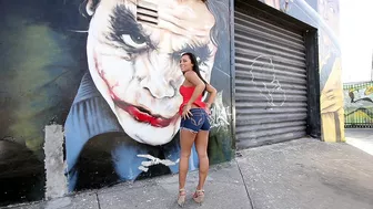 Mom walks by graffiti wall and brandishes her XXX assets on camera