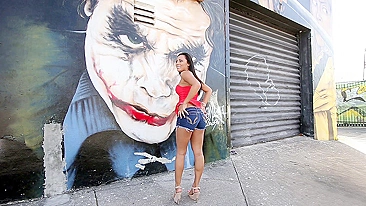 Mom walks by graffiti wall and brandishes her XXX assets on camera