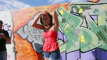 Mom walks by graffiti wall and brandishes her XXX assets on camera