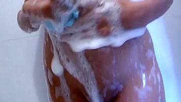 XXX whore tempts while washing natural boobs in the shower cabin